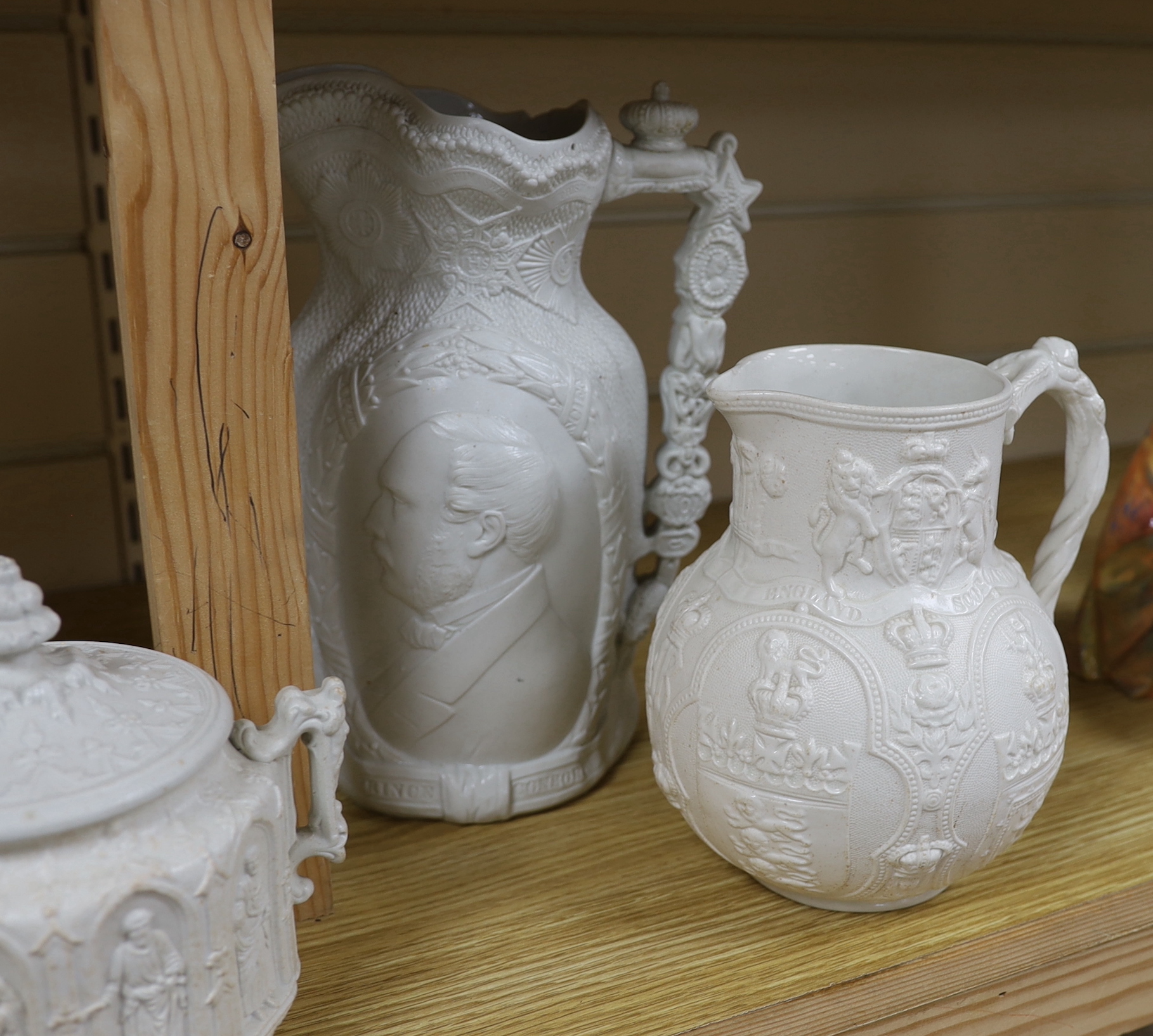 A pair of William Brownfield Parian jugs, moulded with armorials for England, Scotland and Wales, two other Parian ware jugs and a lidded sugar bowl (5), tallest jug 27cm high